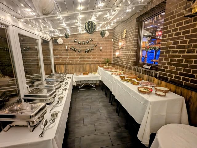 Buffet with chafing dishes at an event at Adam’s