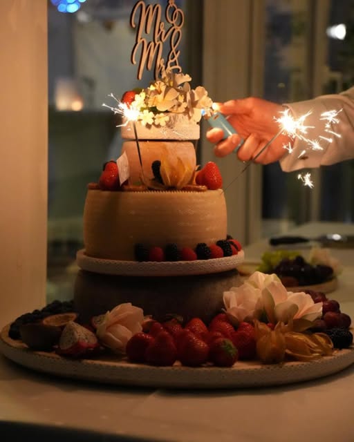 Wedding cake with sparklers at a celebration at Adam’s